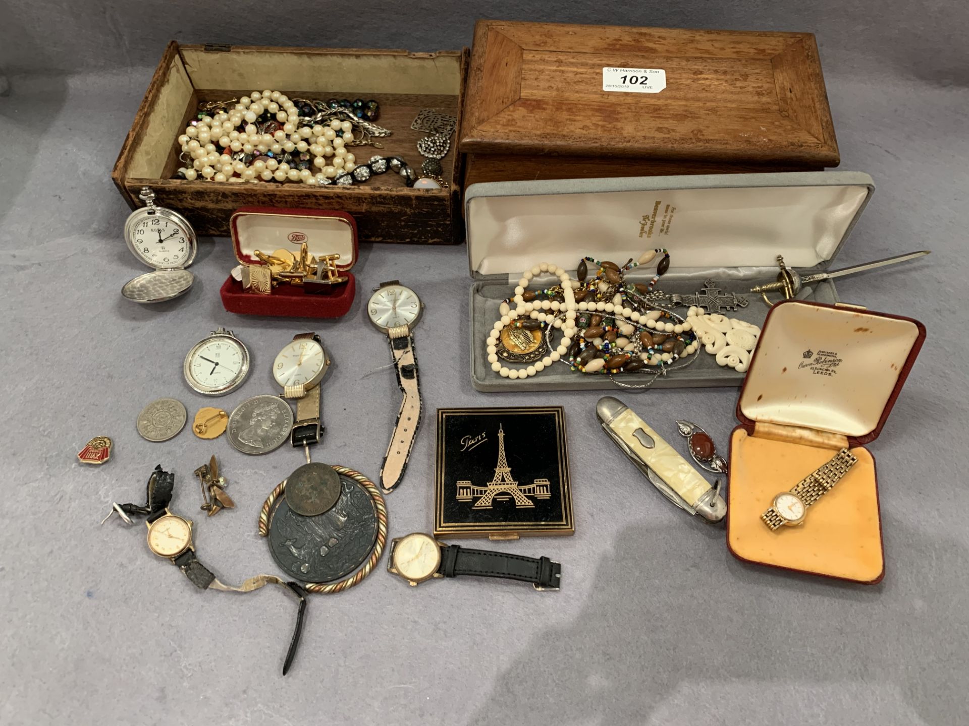 Two boxes containing a small quantity of costume jewellery, watches, coins,