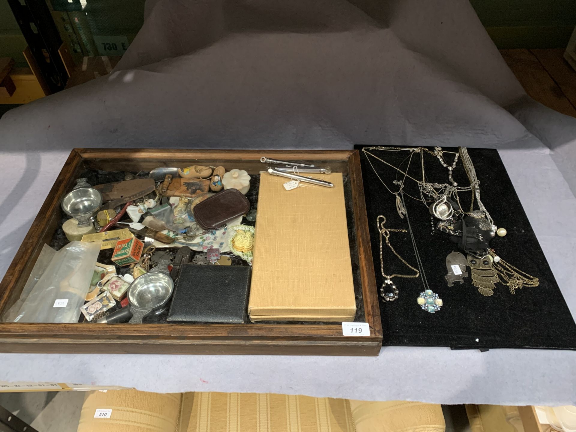 A small quantity of costume jewellery, silver spoon and pusher set - cased, two pewter quaichs,