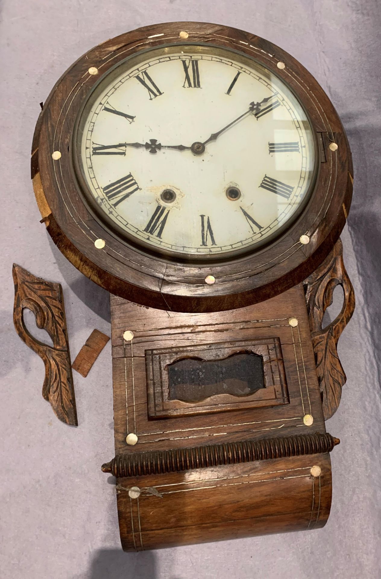 A walnut cased wall clock with circular dial - 70cm,