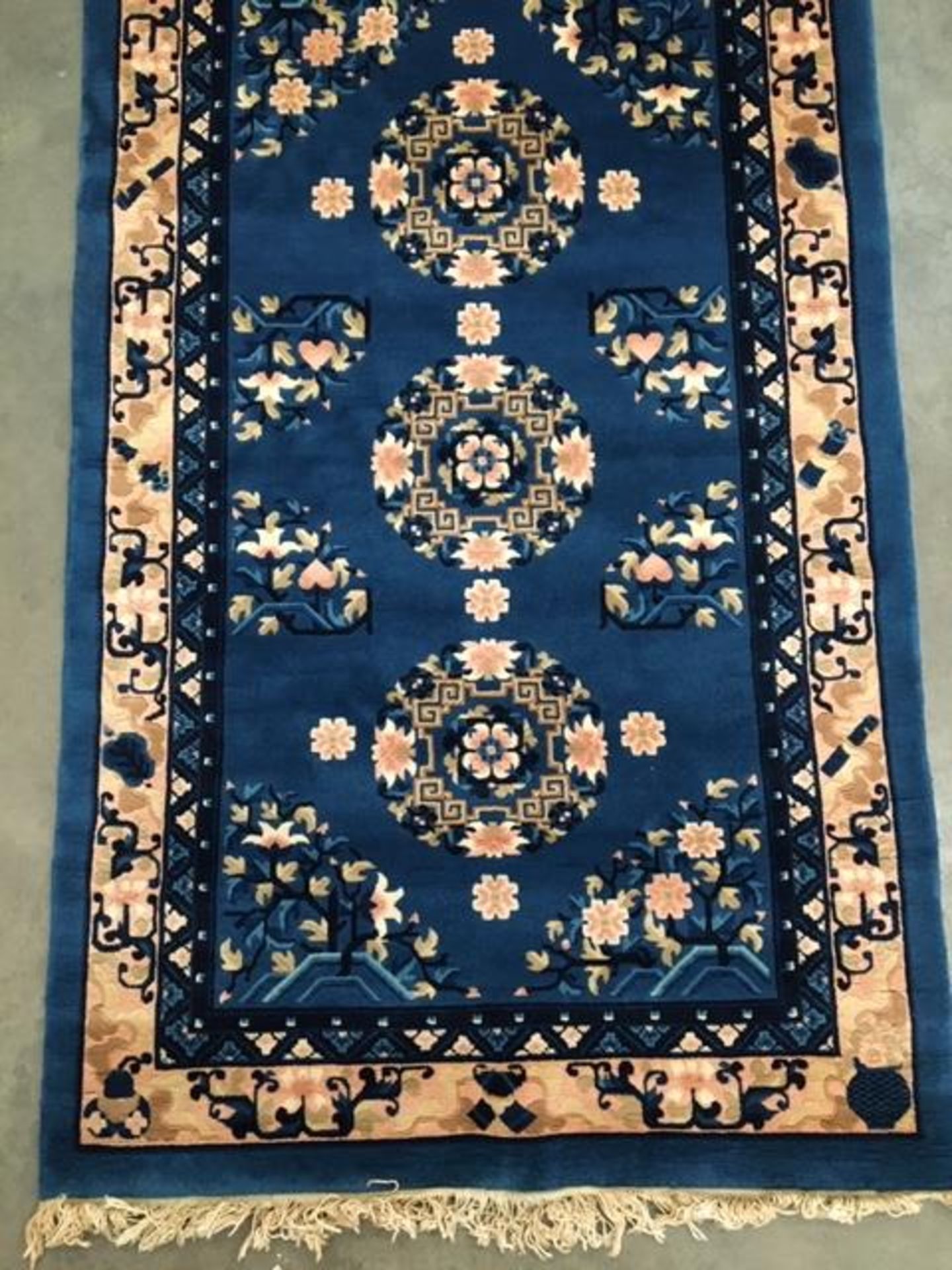 Oriental style rug in blue and pink 92 x 152cm