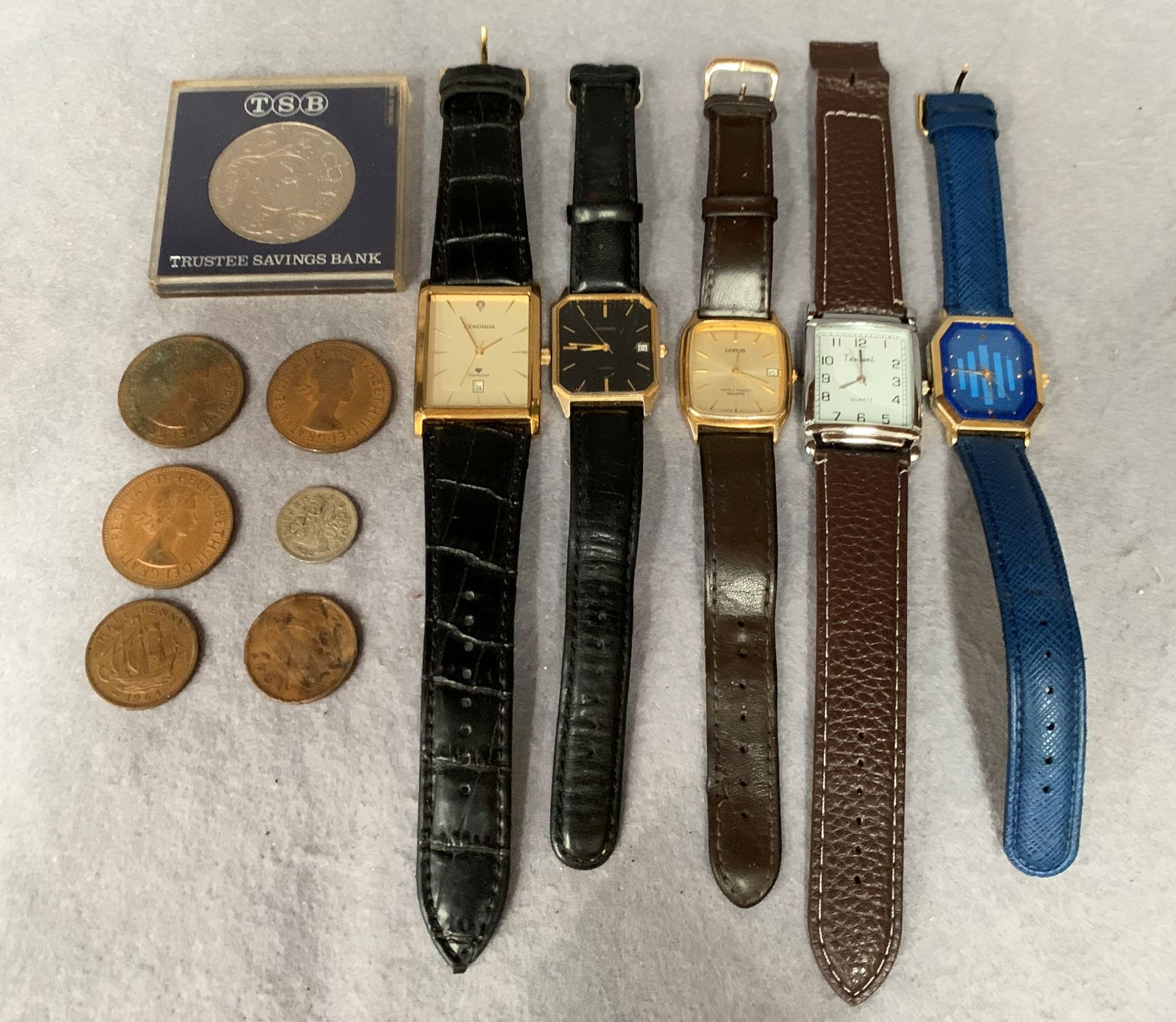 Five gentlemen's fashion wrist watches and a small quantity of coins