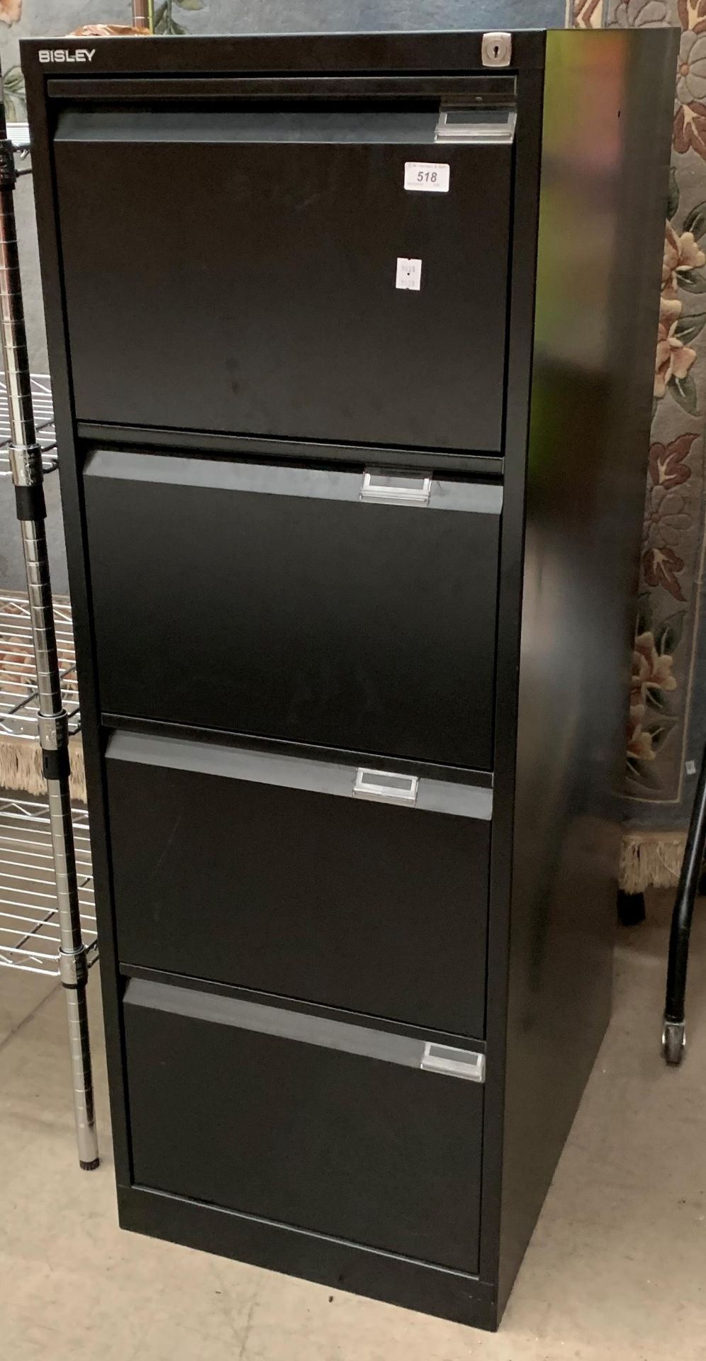 A Bisley black metal four drawer filing cabinet
