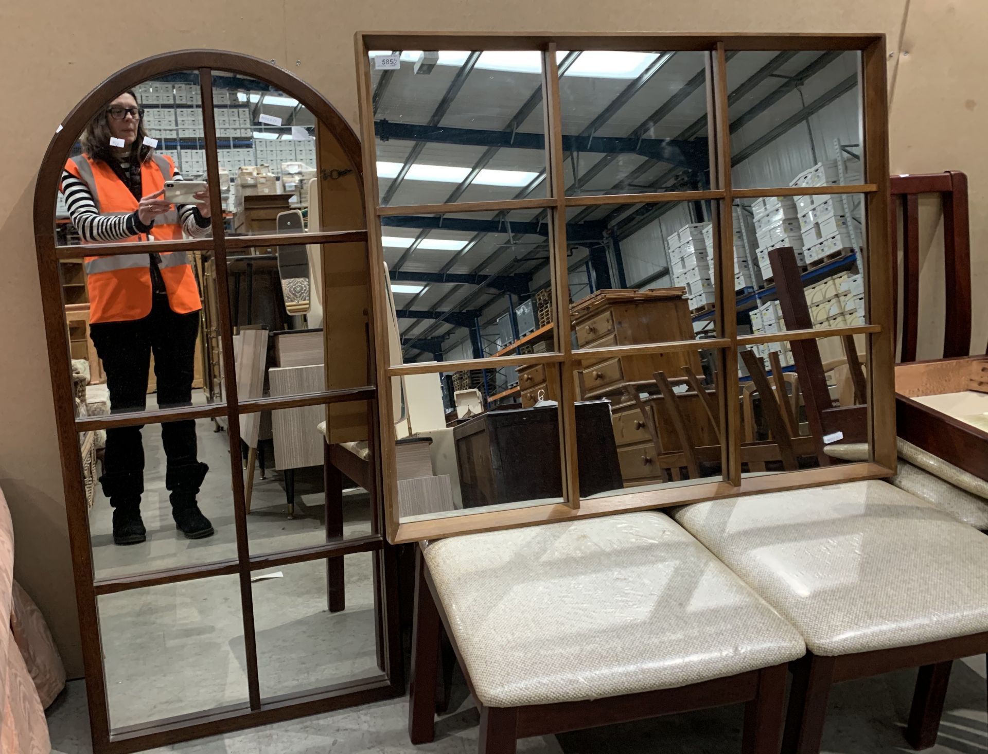 An oak framed 8 section arch top mirror and a rectangular nine section oak framed mirror (2)