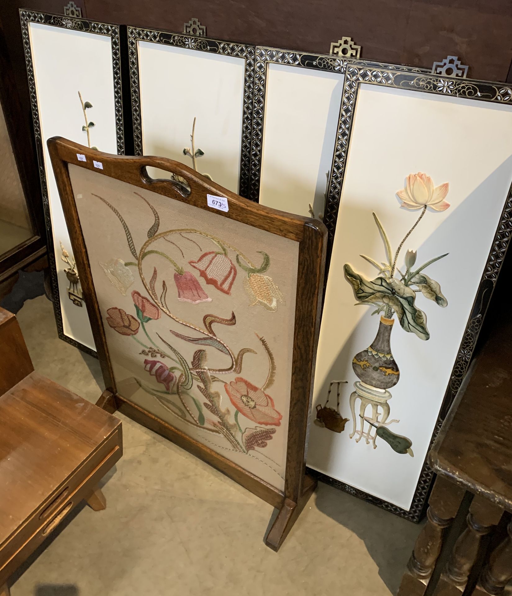 A set of four floral design framed wall hangings and an oak framed embroidered firescreen (5)