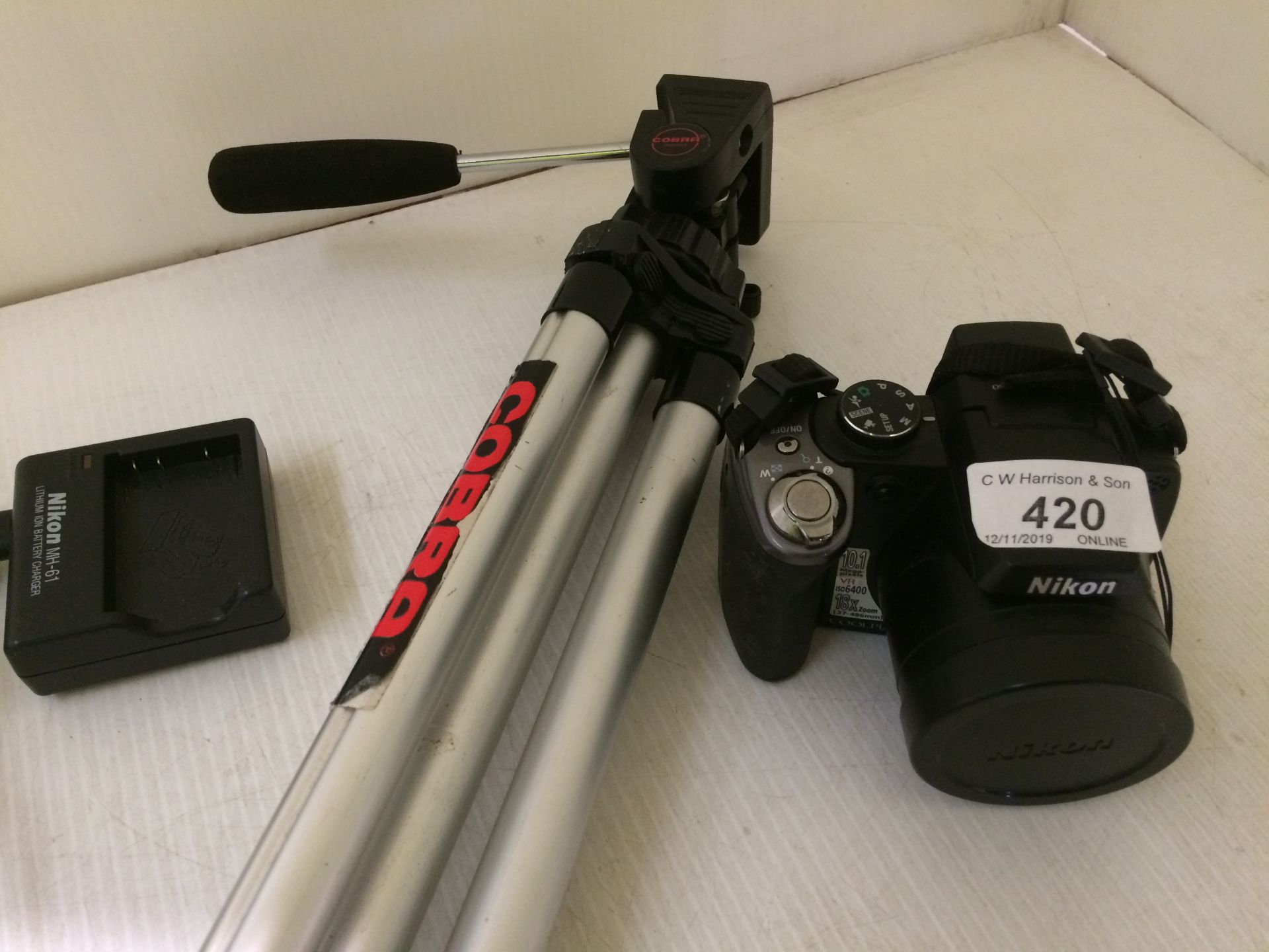 Nikon P80 Coolpix camera and charger and a Cobra Tripod camera stand.