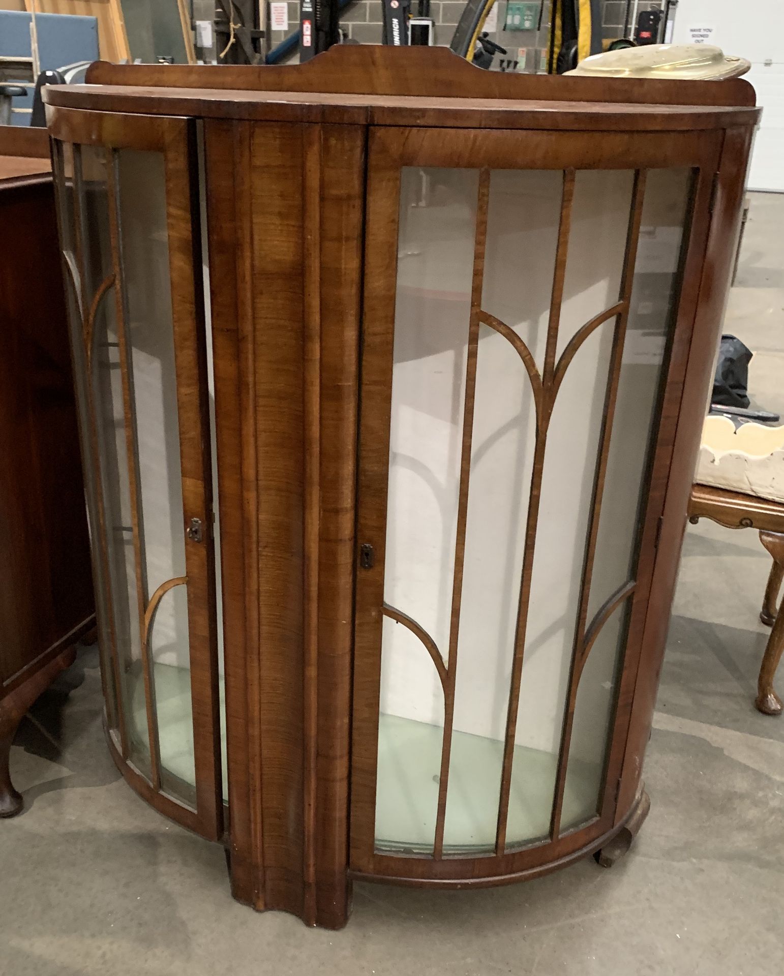 A walnut bow front two door display cabinet 100cm