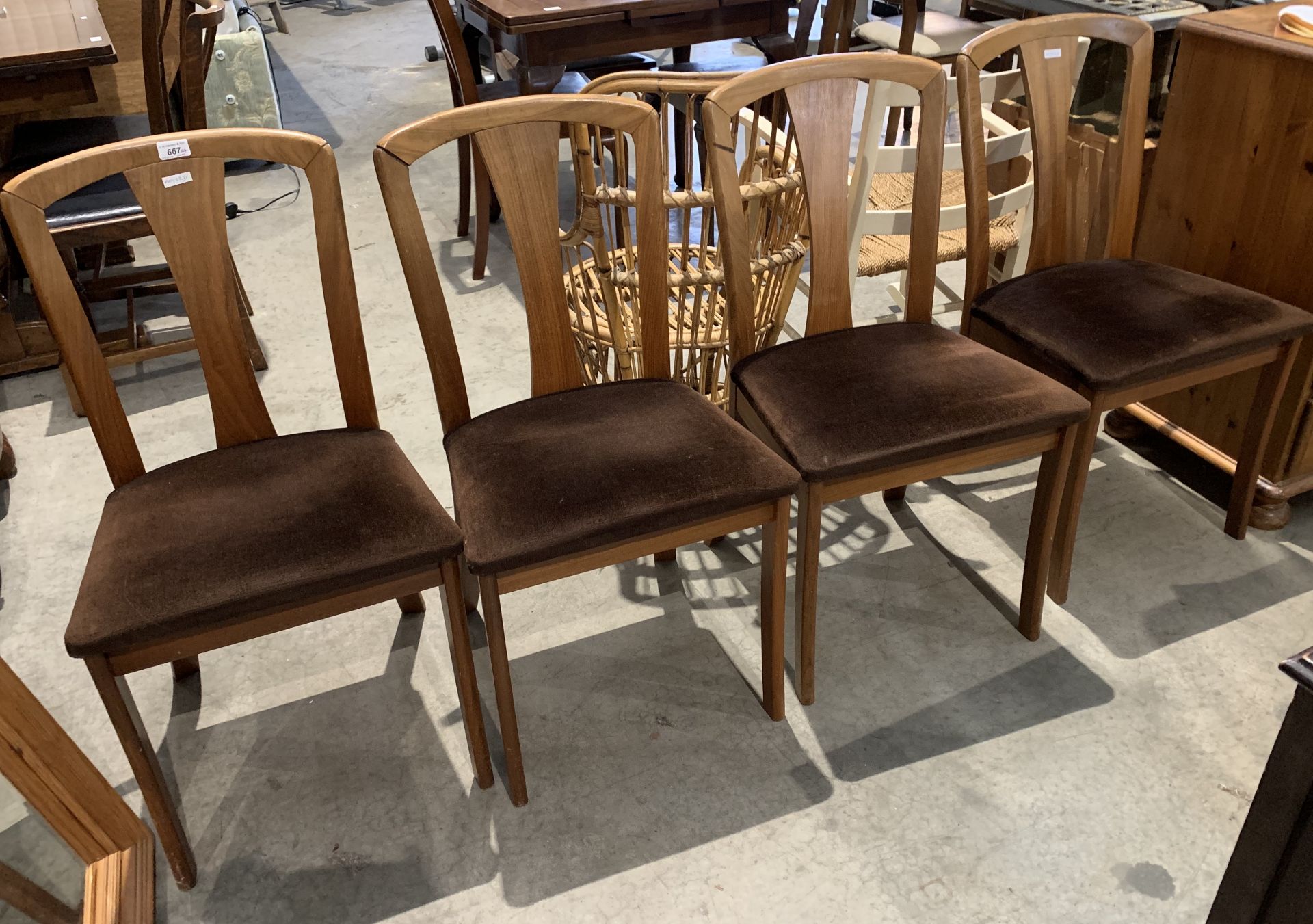 Four Meredew Avalon wood dining chairs [Please note - the upholstery in this lot does not comply