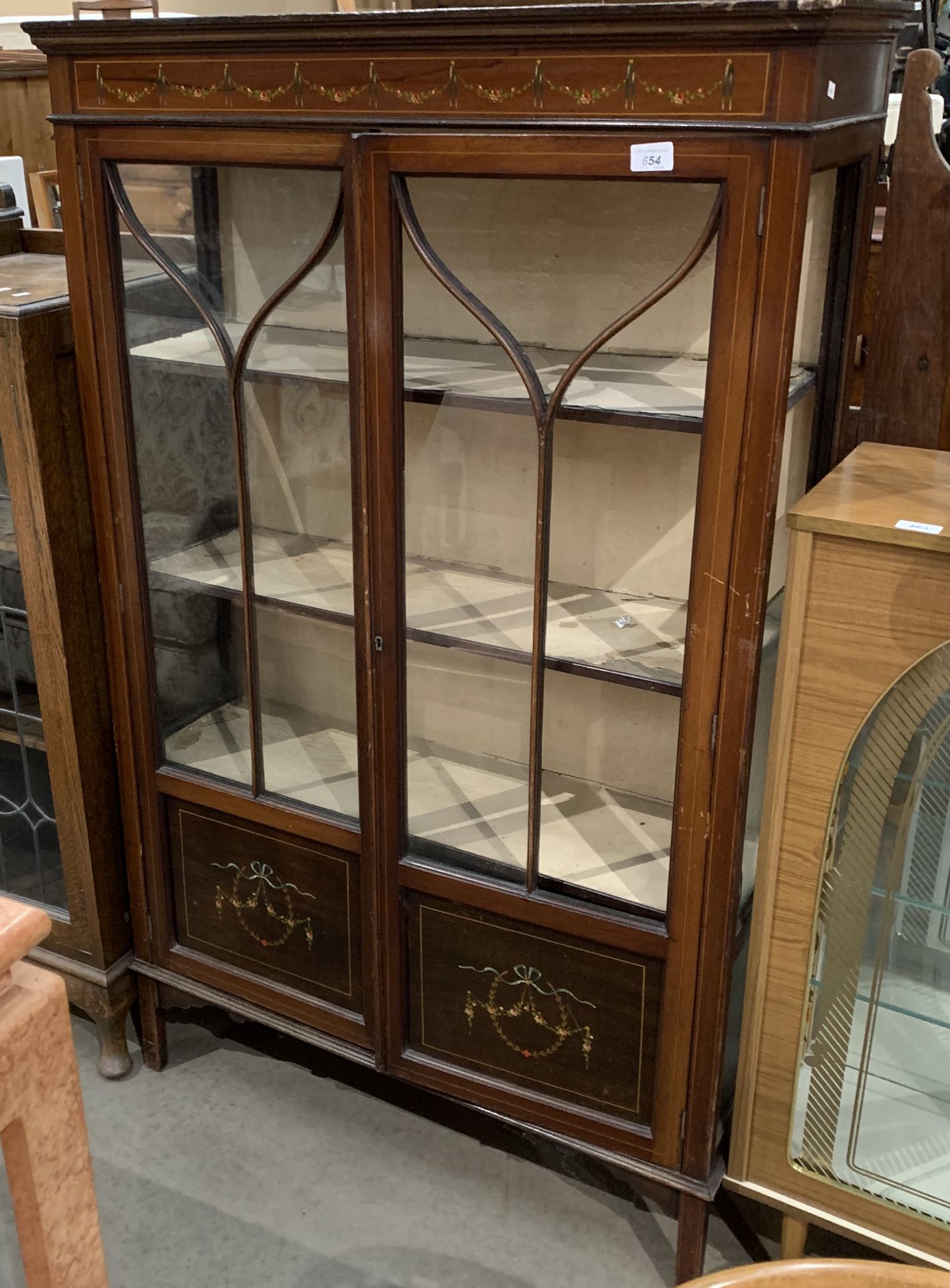 An Edwardian mahogany two door display cabinet with inlay,