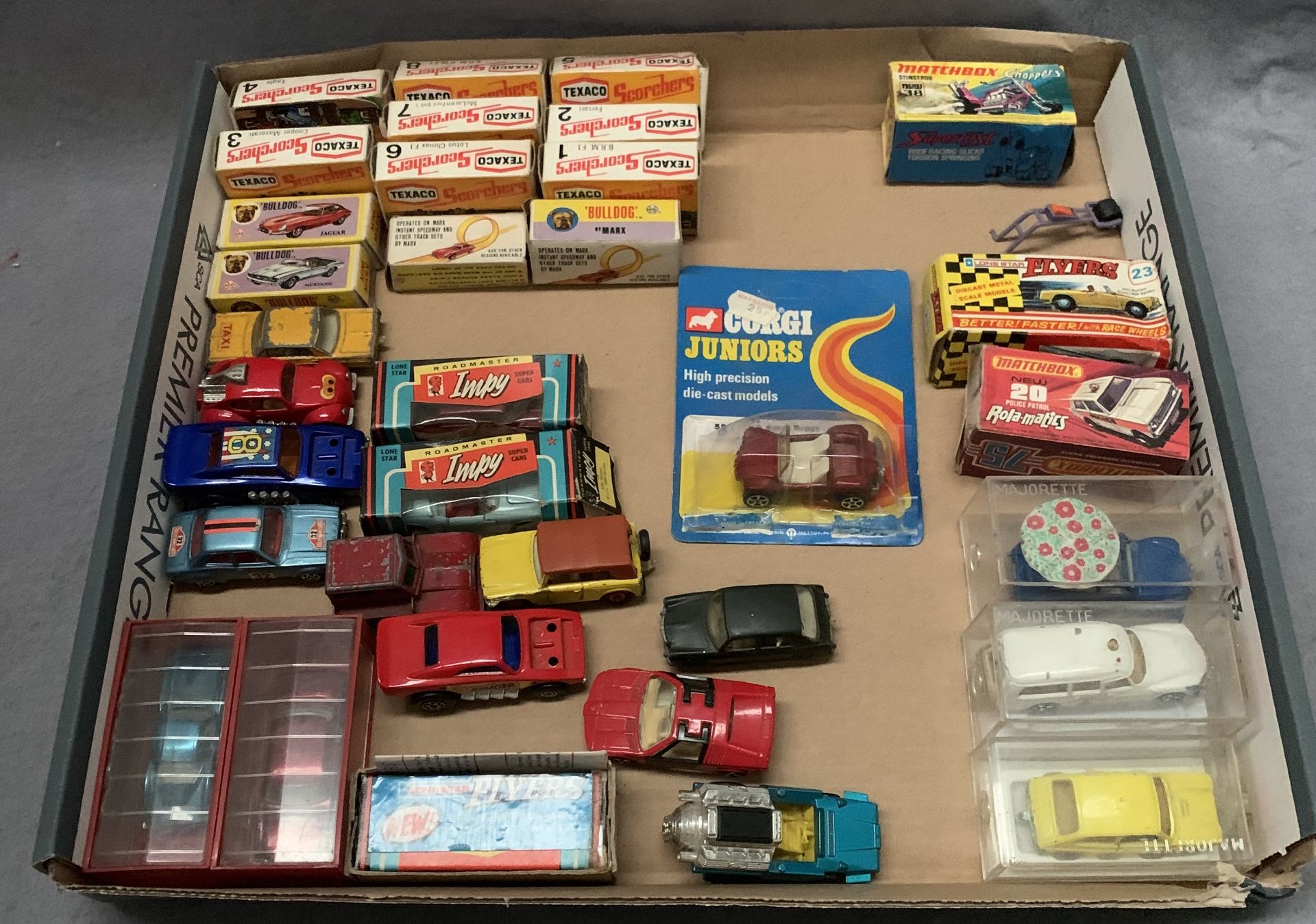 A mixed lot of boxed and unboxed diecast miniature vehicles (33) including Texaco Scorchers, Impy,