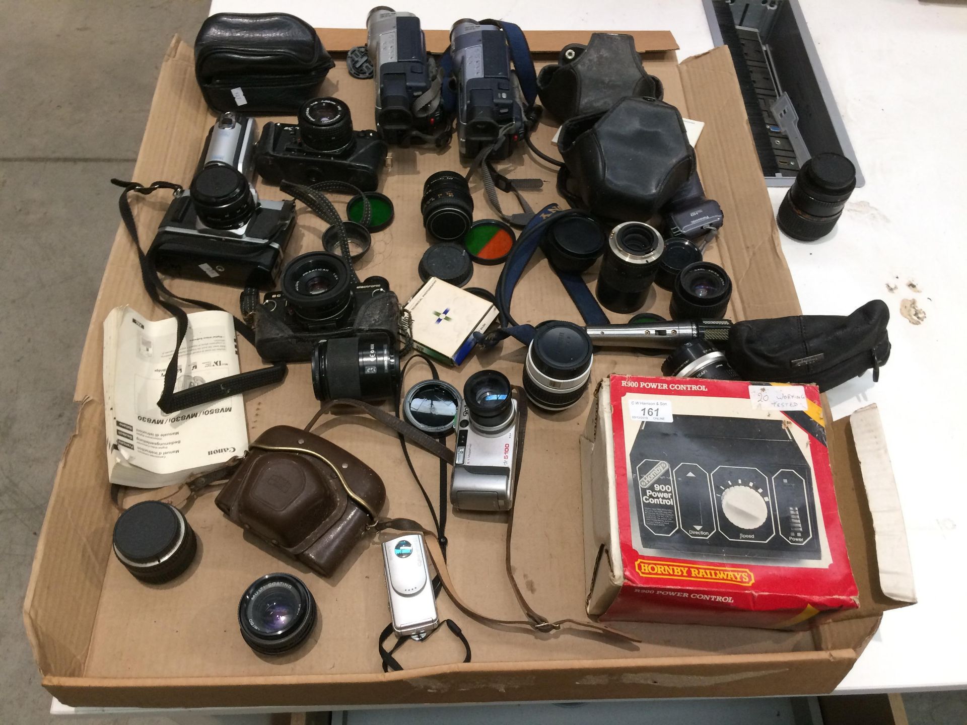 Contents to tray - Praktica BX20 camera, Canon AV1 camera, camera lenses,