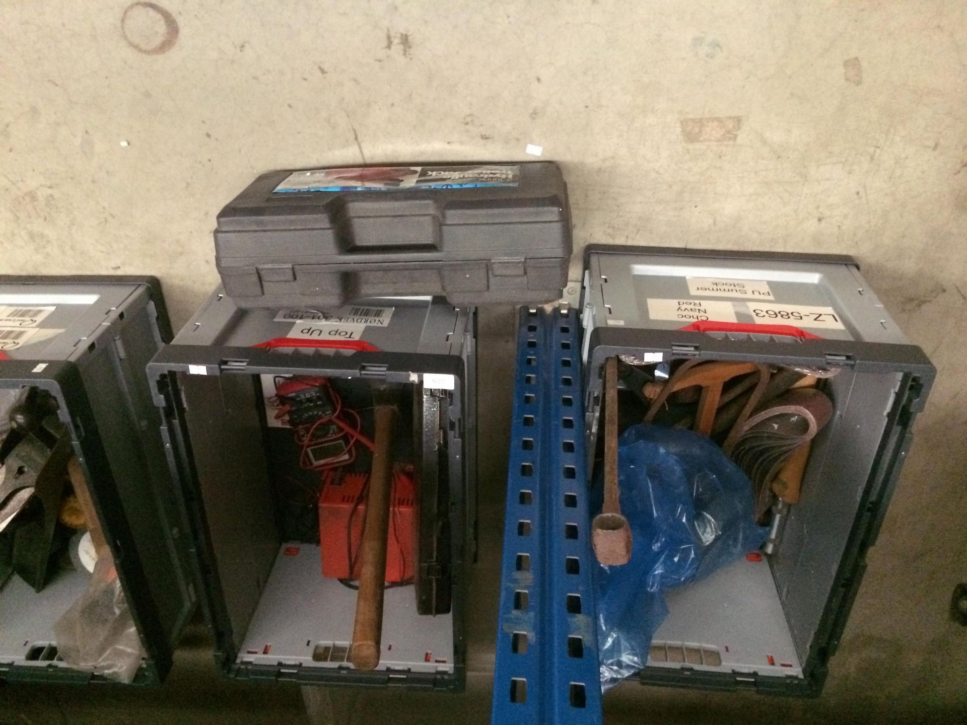 Contents to two crates - socket set, axe, belt sander pads, digital multimeter, battery charge,