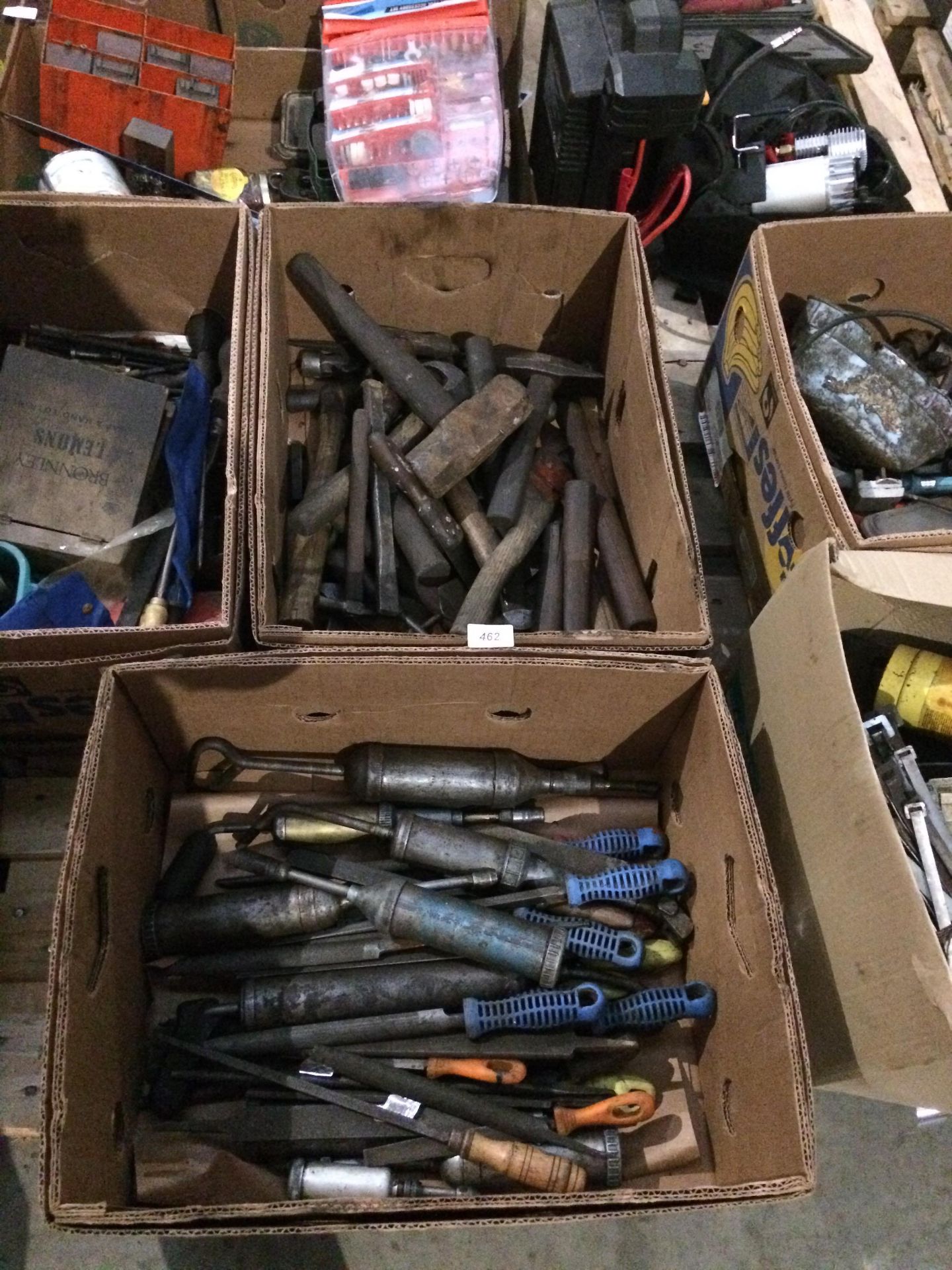 Contents to two boxes - axes, hammers, grease guns, chisels,