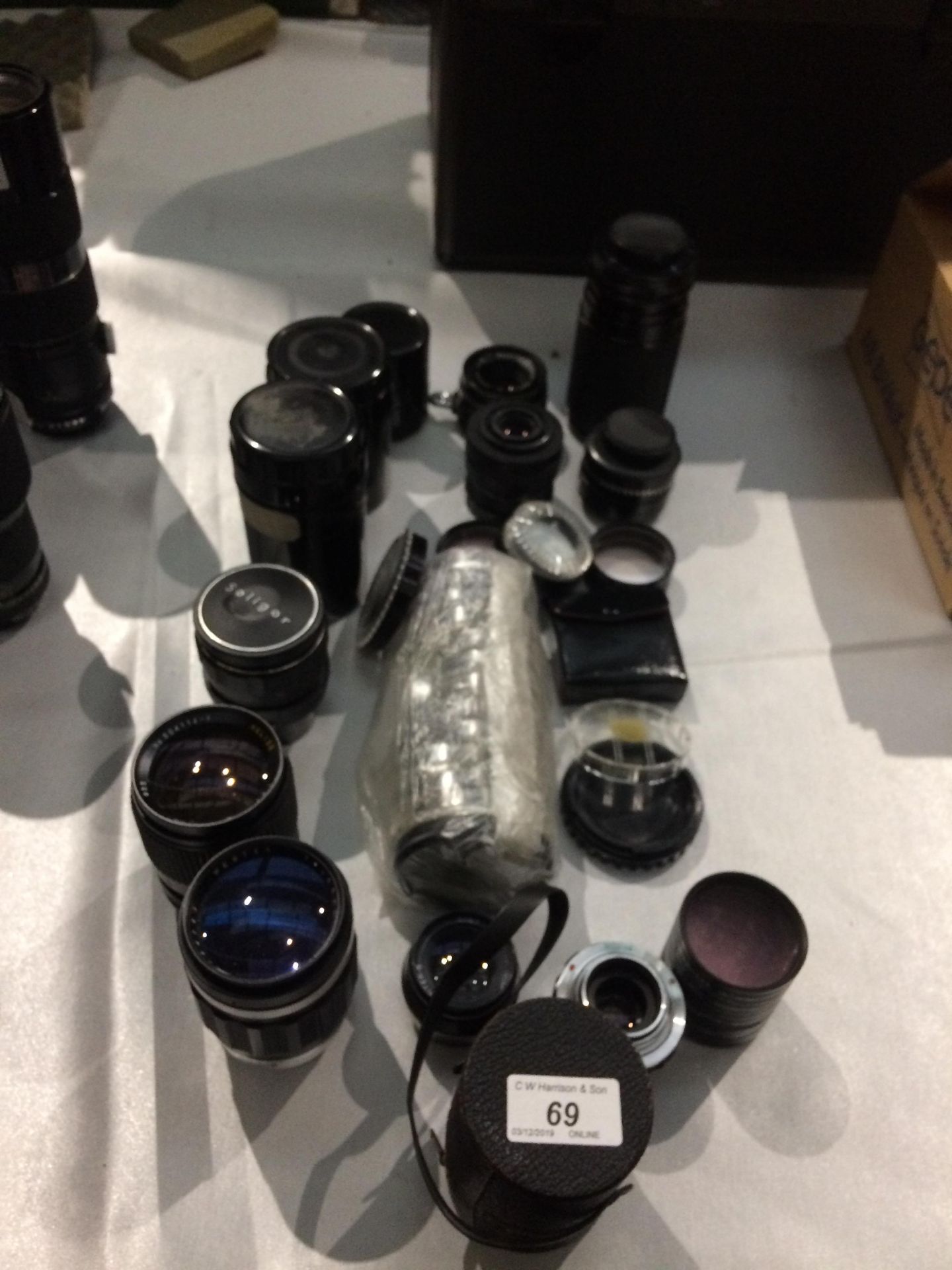 A quantity of assorted camera lens filters etc.