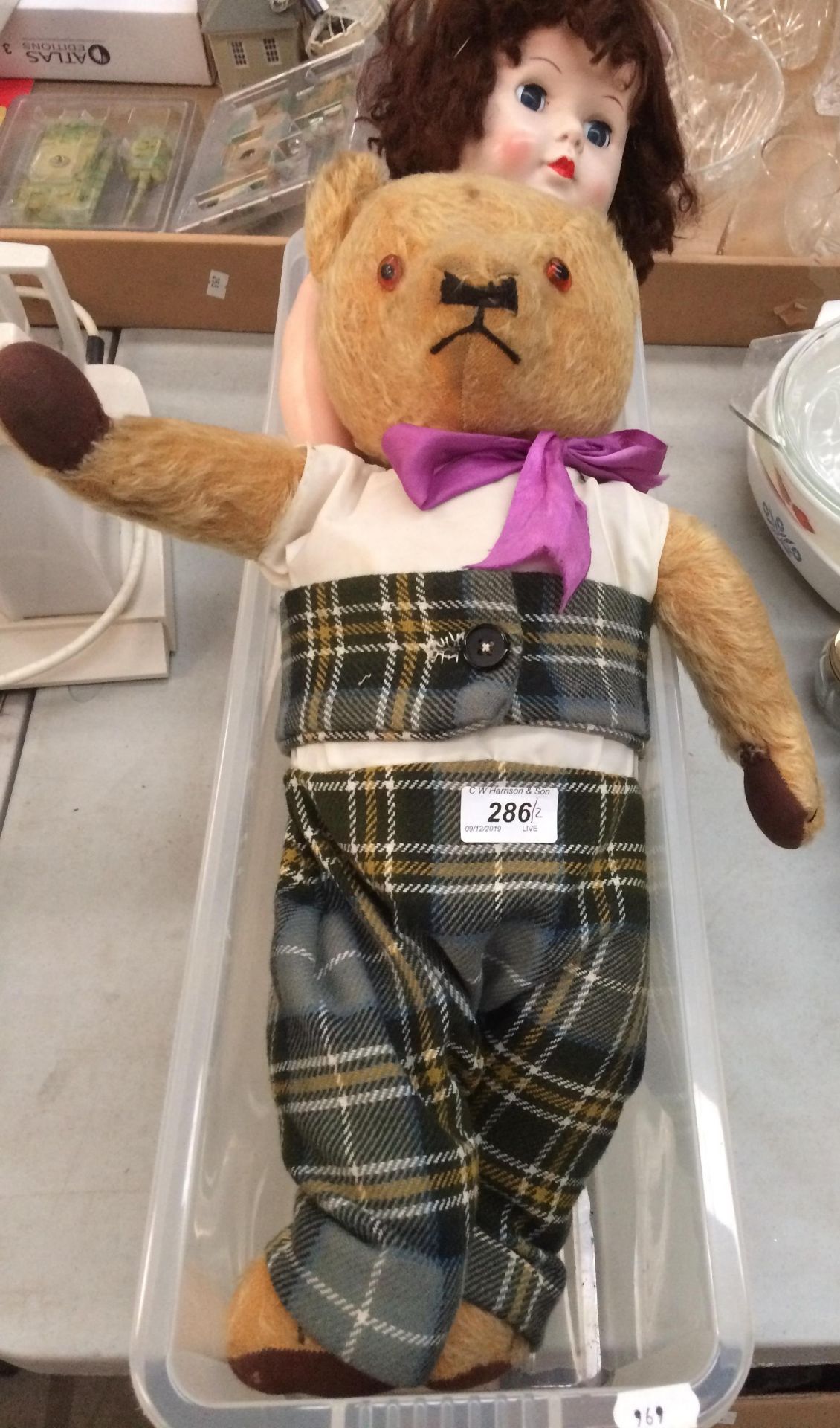 Playworn soft toy bear and a plastic doll (2)