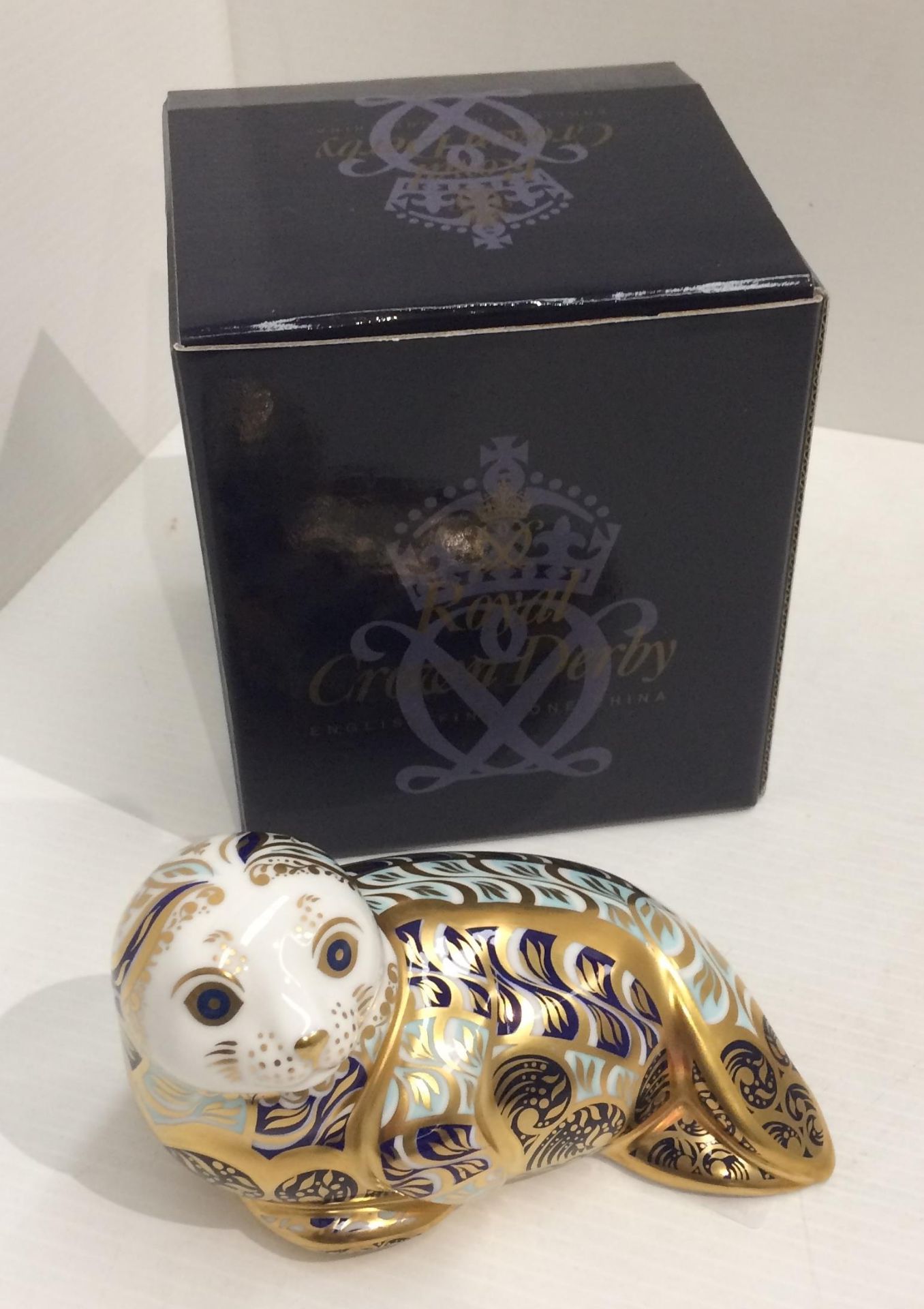 A Royal Crown Derby bone china limited edition Harbour Seal paperweight - 13cm long, no.