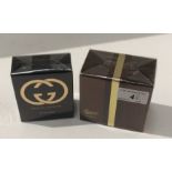 A packaged 50ml bottle of Gucci by Gucci Eau de Parfum natural spray and a packaged 50ml bottle of