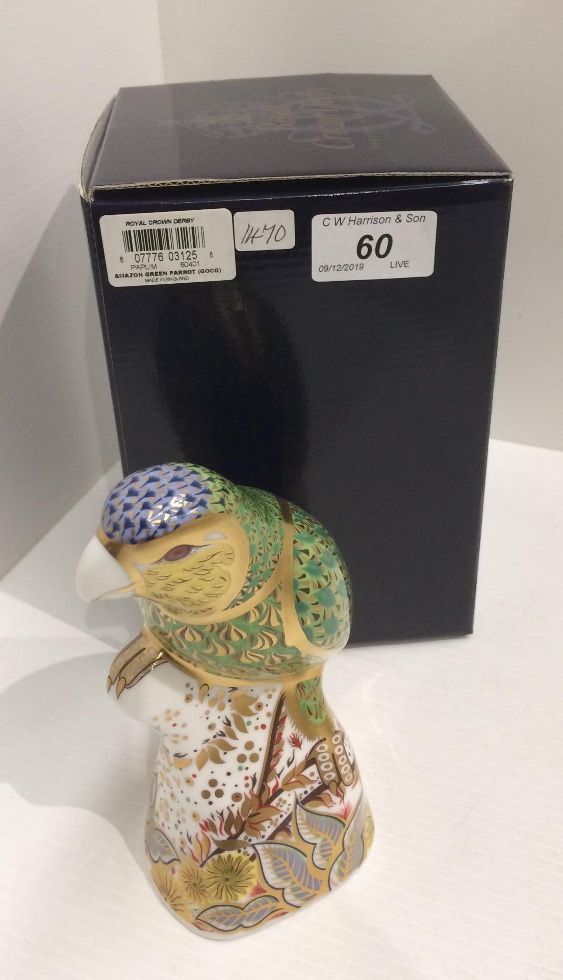 A Royal Crown Derby bone china specially commissioned edition Amazon Green Parrot paperweight -