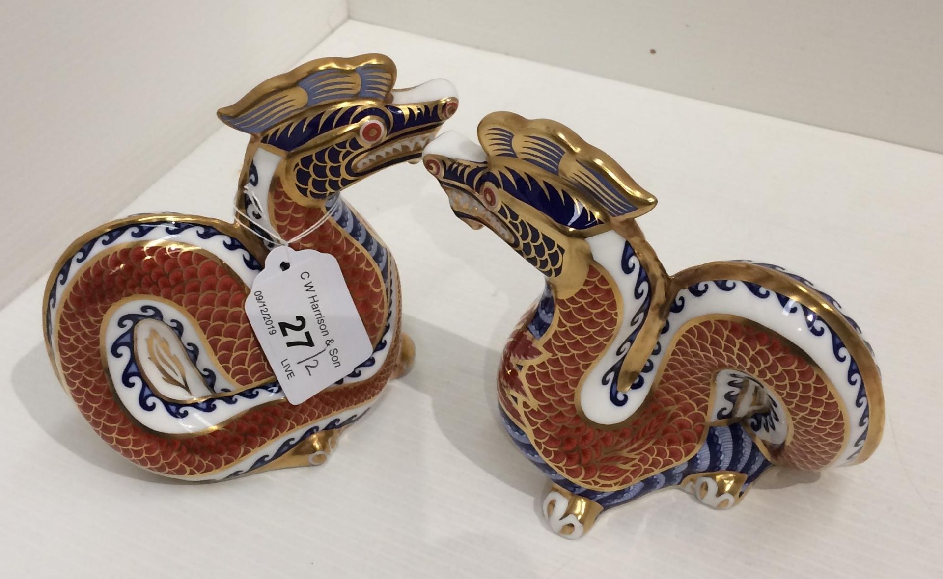 Two Royal Crown Derby bone china Dragon paperweights 12cm high (2)