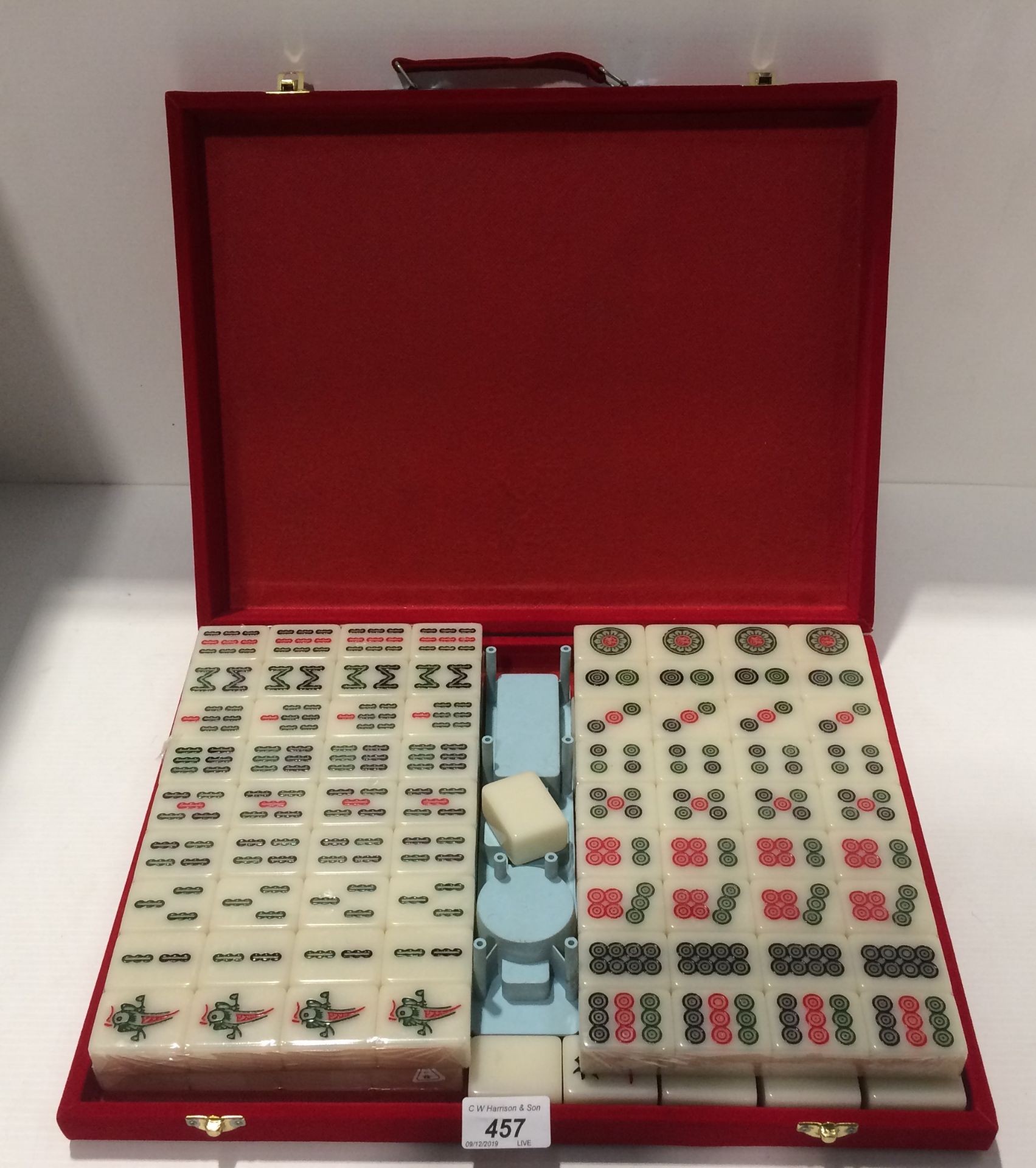 Mahjong travel board game in a red velvet travel case