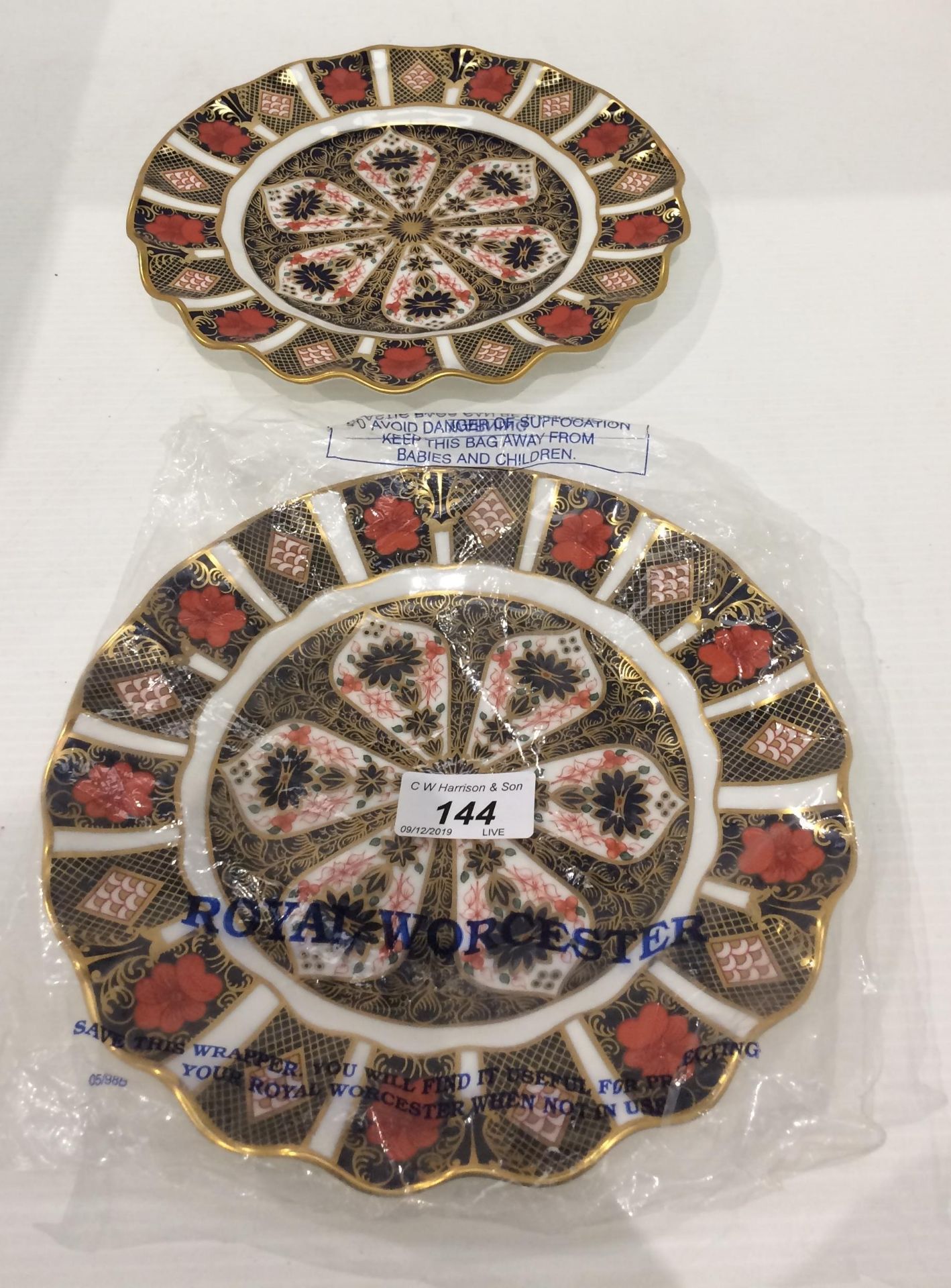Two Royal Crown Derby Old Imari pattern plates each 22cm diameter