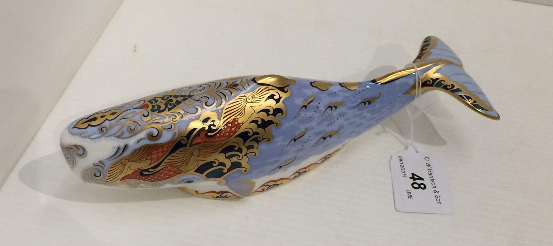 A Royal Crown Derby bone china Collectors Guild Exclusive Oceanic Whale paperweight - 22cm long,