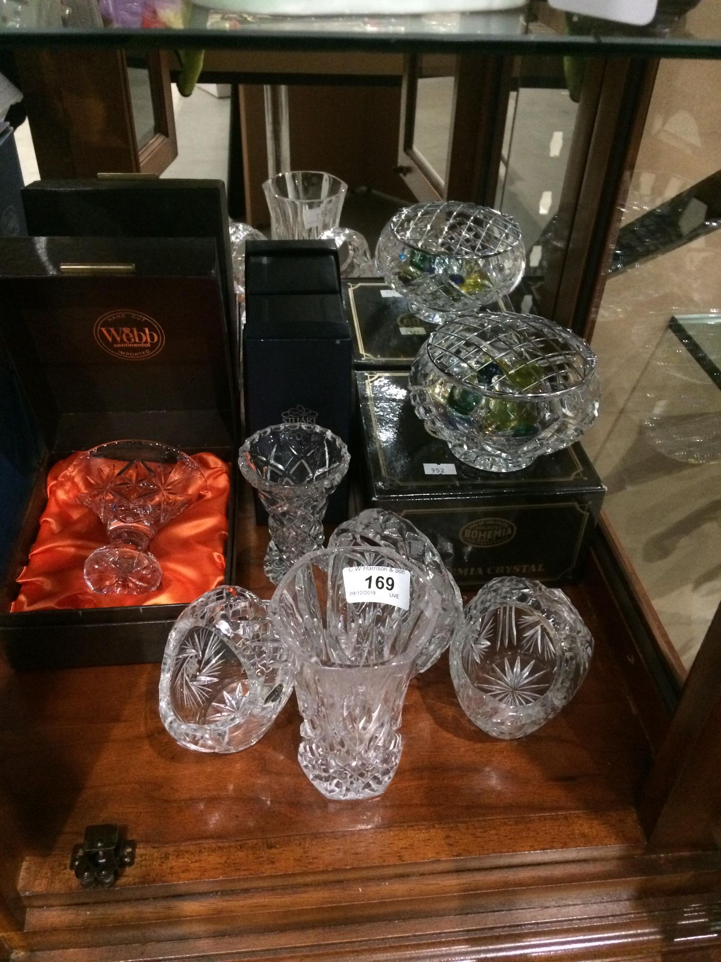 Contents to corner bottom shelf of cabinet - various lead crystal glasses and vases by Webb,
