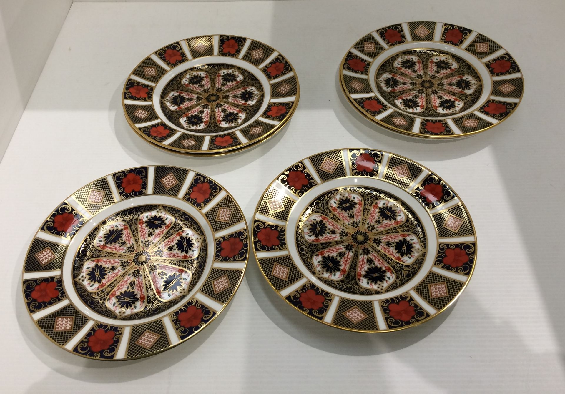 Six Royal Crown Derby bone china Old Imari pattern plates - each 22cm diameter