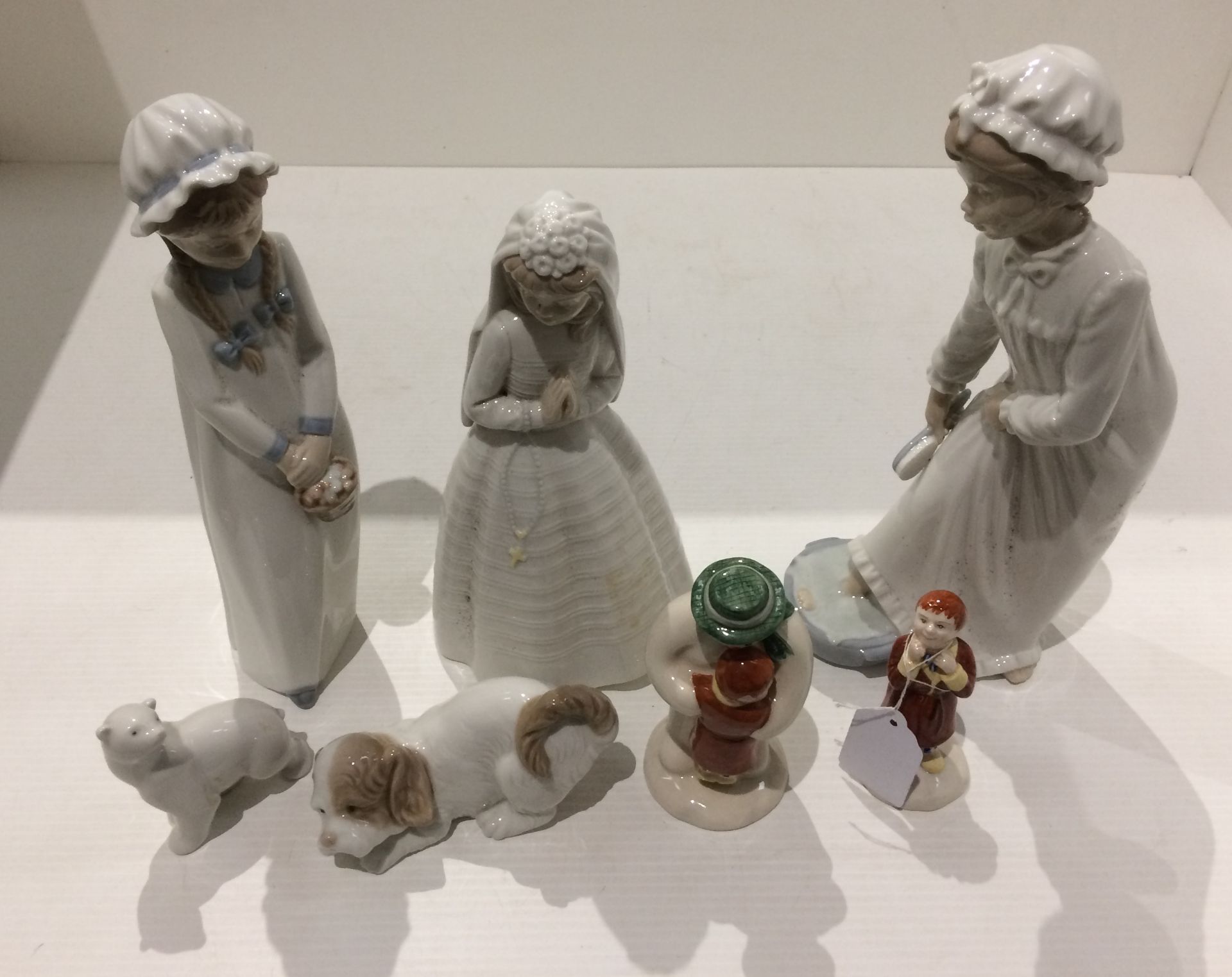 Three Nao female figurines, two Nao animals - dog and polar bear,