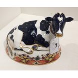 A Royal Crown Derby bone china Friesian Cow Buttercup paperweight - 18cm long