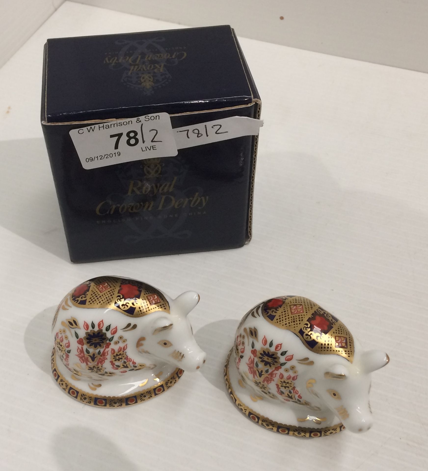 Two Royal Crown Derby bone china paperweights of Piglets each 7cm long (only one with box)