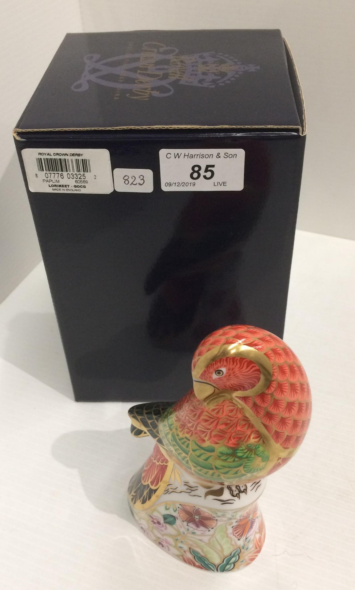 A Royal Crown Derby bone china specially commissioned edition Lorikeet paperweight - 15.