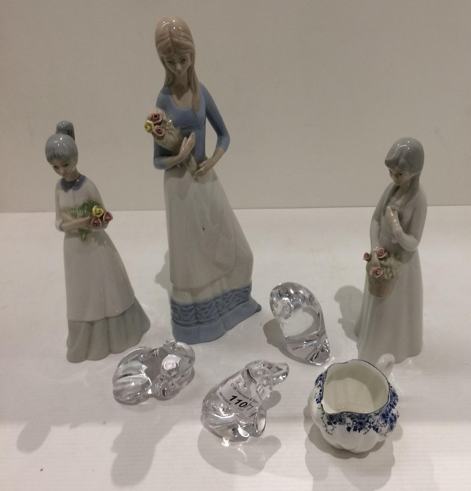 Three Spanish porcelain figures of young ladies,