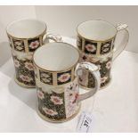 Three Royal Crown Derby bone china Traditional Imari Millennium 2000 tankards, each 14cm high,