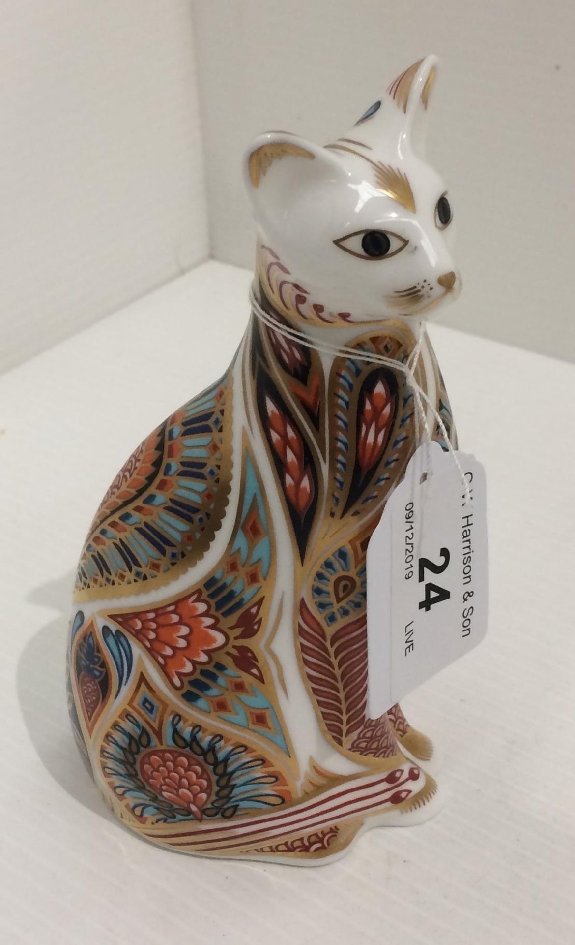A Royal Crown Derby bone china cat paperweight 14cm high