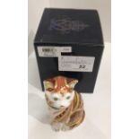 A Royal Crown Derby bone china Marmaduke cat paperweight - 14cm high,