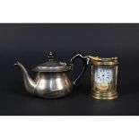 A small silver teapot (as found) plus a brass and porcelain miniature clock (as found)