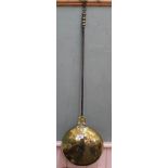 An 18th Century brass warming pan with iron handle