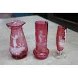 Three pieces of cranberry Mary Gregory glass