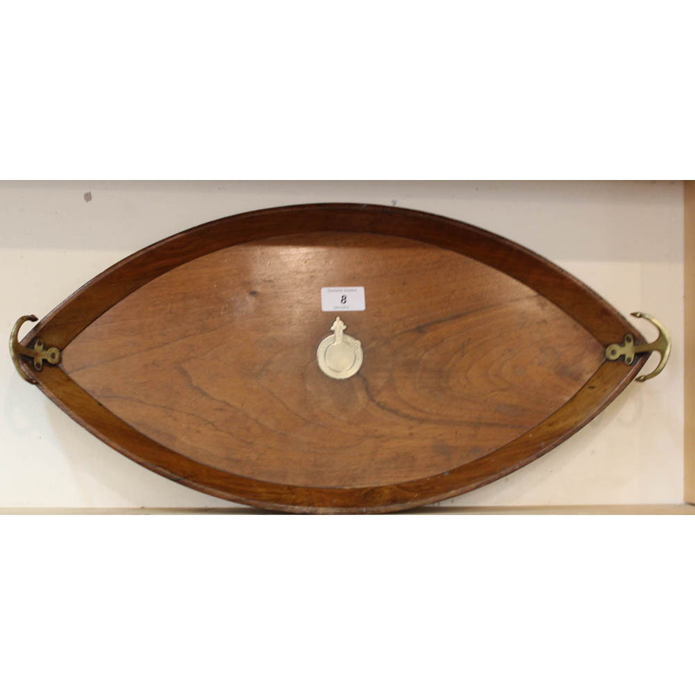 A late 19th Century oak nautical themed cocktail tray shaped as a boat hull and inlaid with central