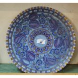 A Crown Ducal Charlotte Rhead blue and gilt floral charger,