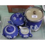 Four pieces of Wedgwood Blue Jasperware including a biscuit barrel