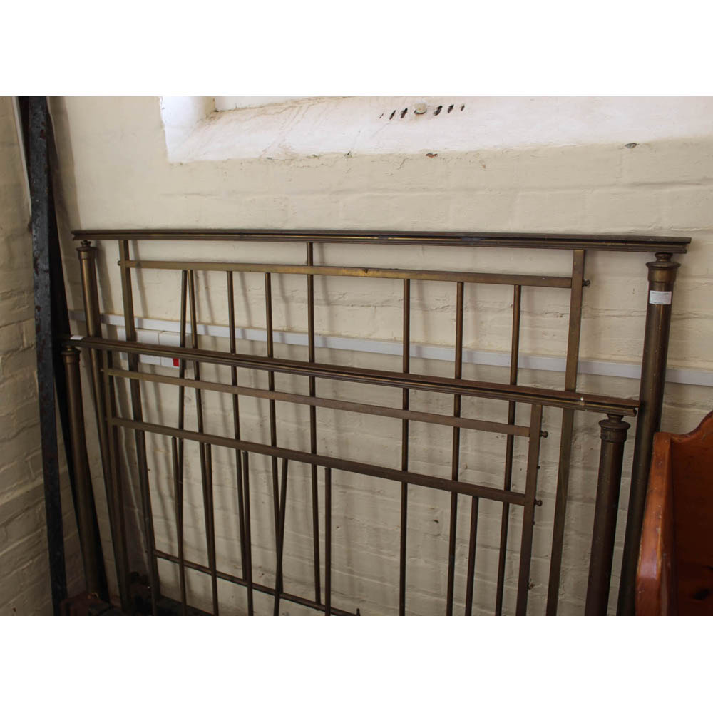 A modern metal single bed frame and a brass and iron double bed frame