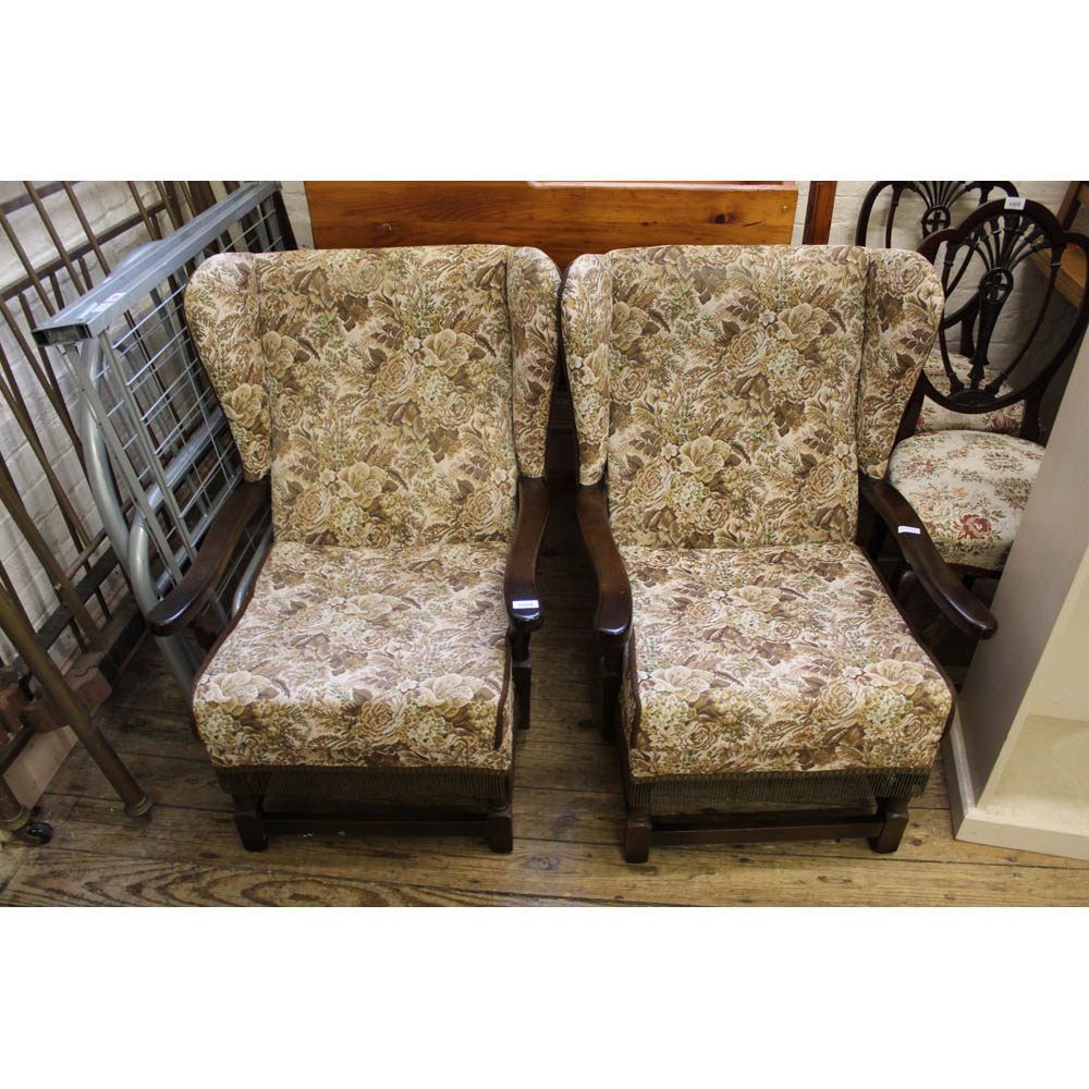 Two tapestry upholstered wing back armchairs