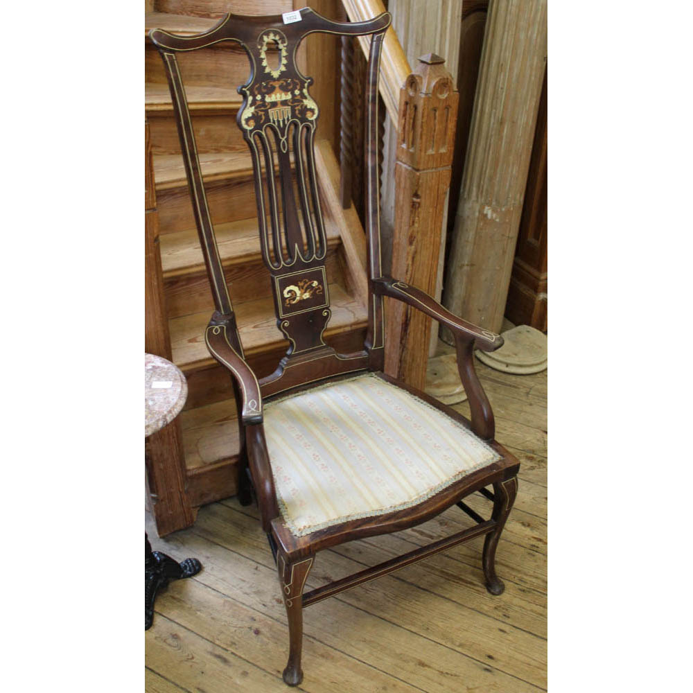 An Edwardian inlaid mahogany high back armchair