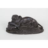 A bronze of a seated lioness fighting an alligator,