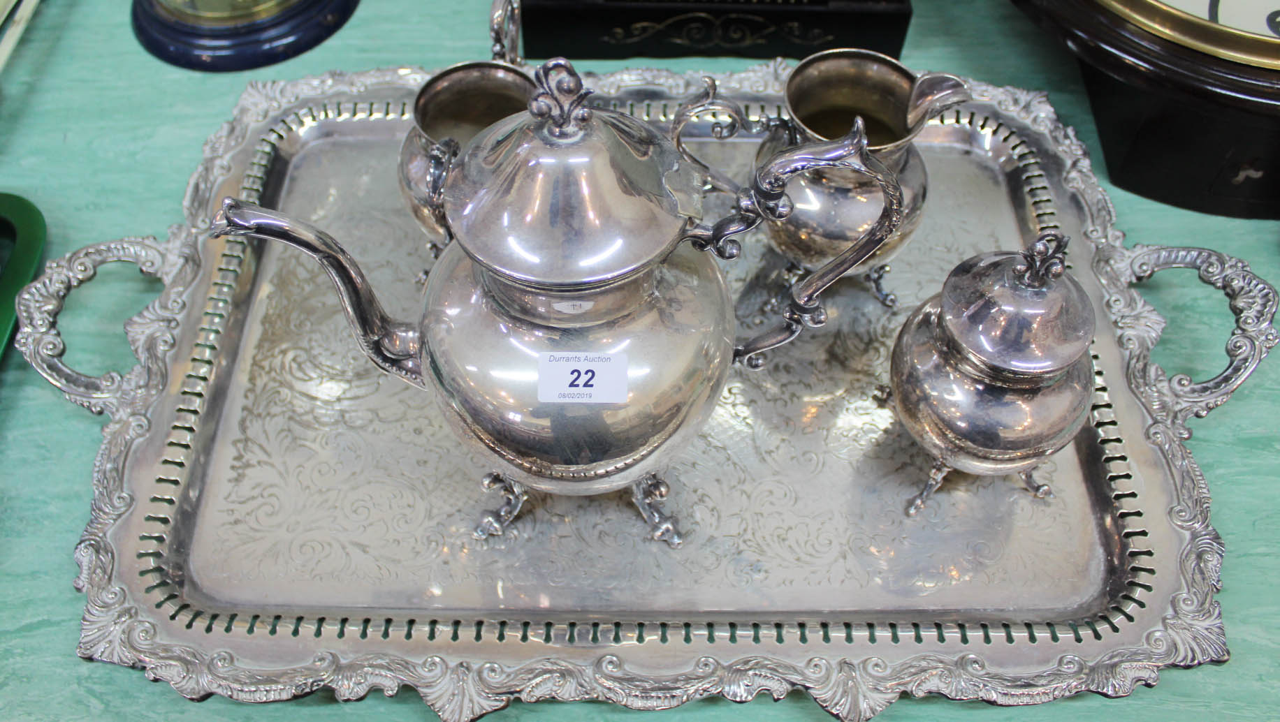 A large silver plated tray plus a four piece tea set