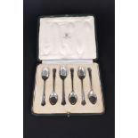 A set of six teaspoons in a box