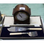 An oak mantel clock plus cased cake servers