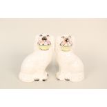 A pair of Victorian Staffordshire dogs with baskets of flowers (light cracks)