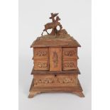 A Black Forest jewel cabinet with deer mount
